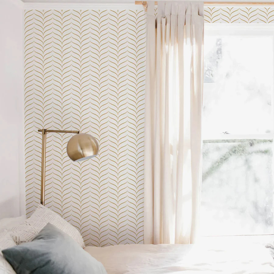 Light coloured bedroom with chevron wallpaper